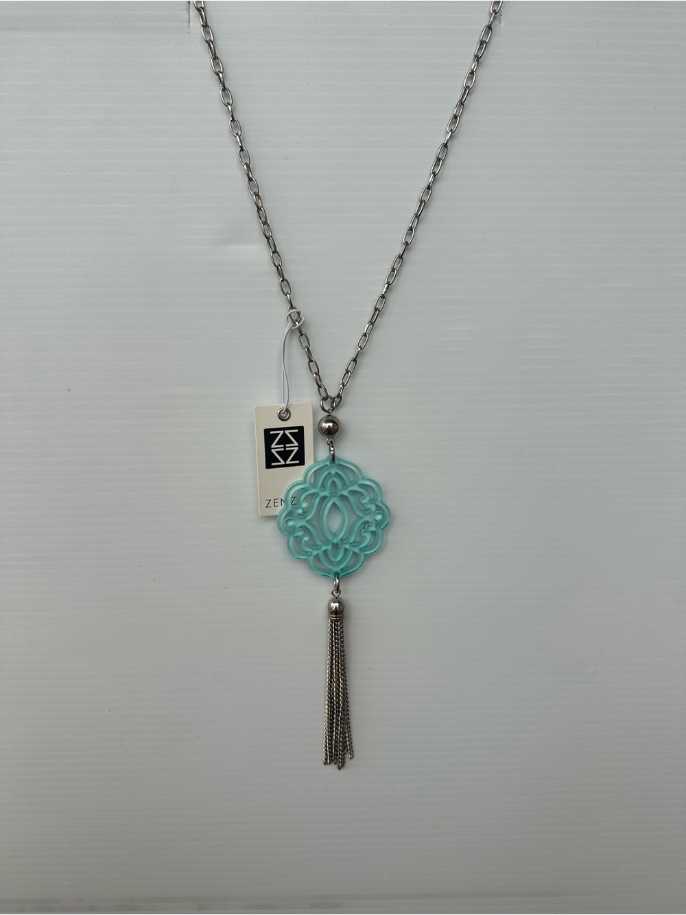 Aqua Zenzii Pendant Necklace with Silver Tassel
